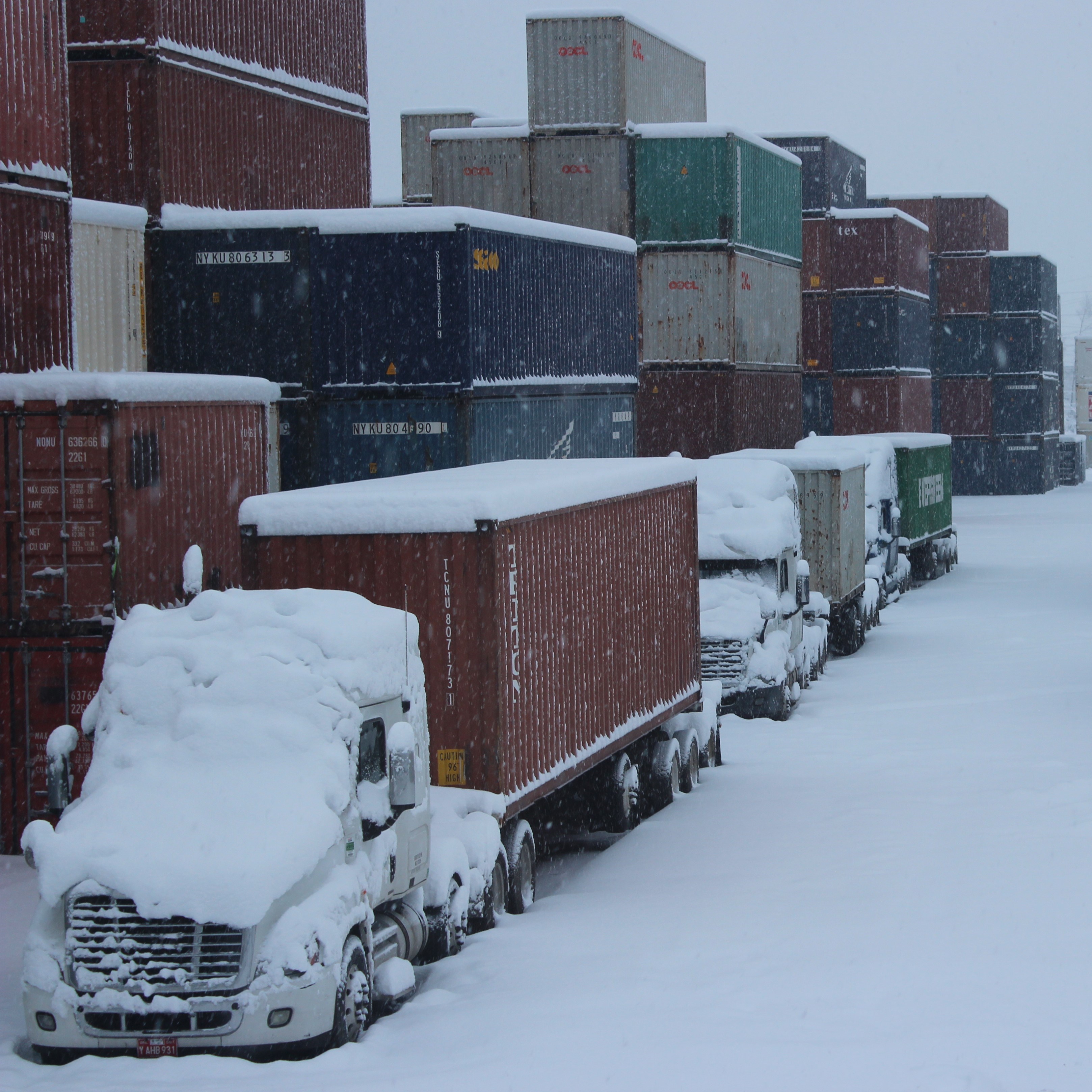 PCR TRUCKS AT CY COVERED IN SNOW